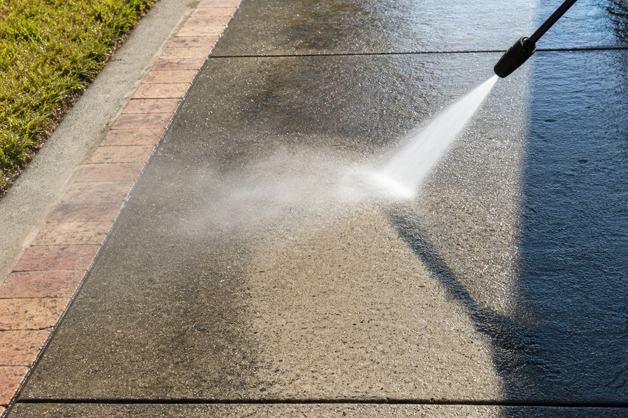 Sidewalk being power washed